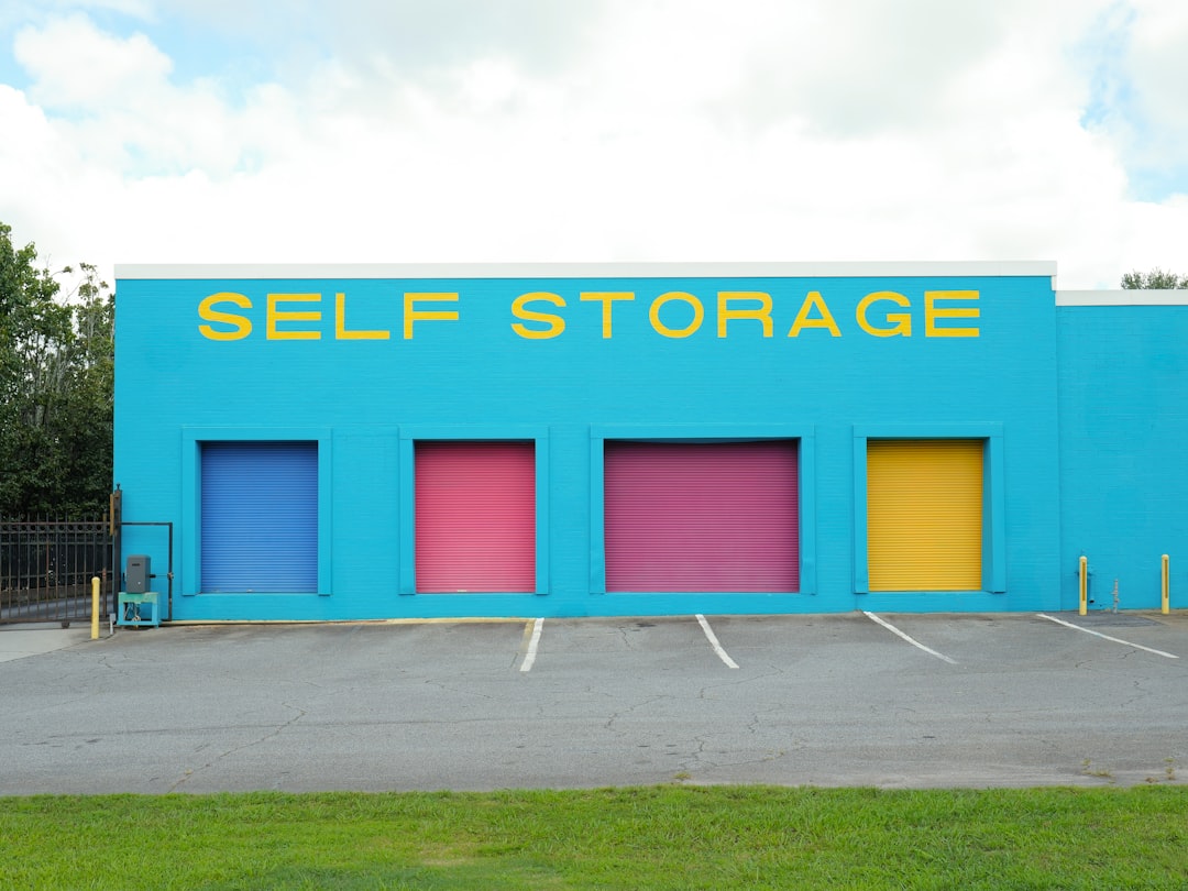brightly-colored-self-storage-building-with-four-doors-xyoneoawqbk